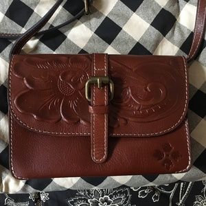 Tooled leather bag and wallet
